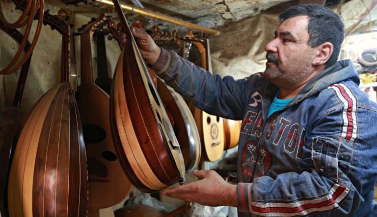 Ali Mohammed, 48, builds an oud, an Arabic instrument related to the lute, at his workshop in Baghdad, Iraq, Tuesday, Jan. 30, 2018. Mohammed says "the demand for Oud has risen after the defeating of IS in Iraq" he, makes around 400 U.S. dollars by selling one handmade oud every month.