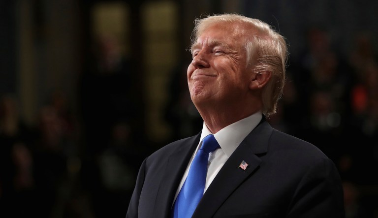 President Donald Trump smiles during an address in Washington. 