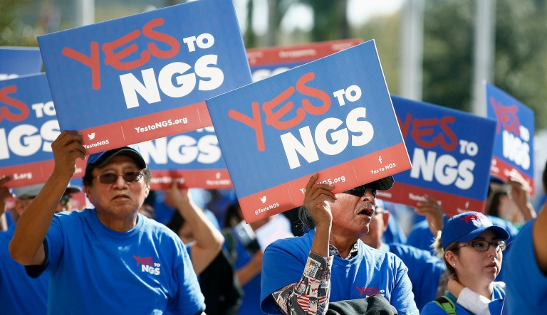 A coalition of groups march during a rally to build support for extending the life of the Navajo Generating Station power plant near the Arizona-Utah border, in front of the Arizona Capitol Tuesday, Feb. 6, 2018, in Phoenix. 