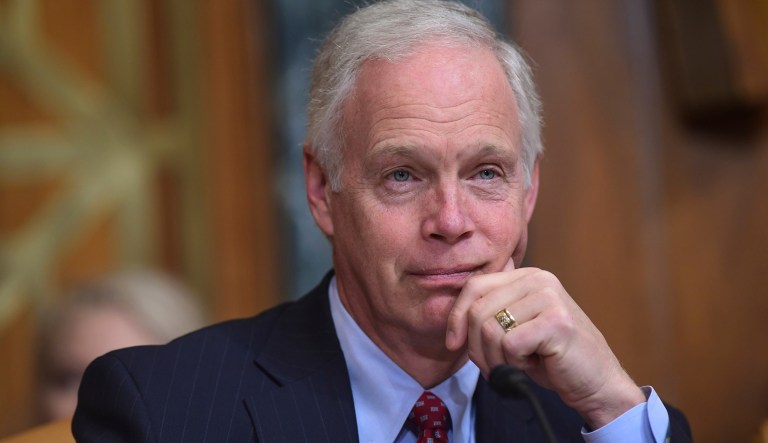Sen. Ron Johnson, R-Wis., listens as Budget Director Mick Mulvaney testifies before the Senate Budget Committee on Capitol Hill in Washington, Tuesday, Feb. 13, 2018, on President Donald Trump's fiscal year 2019 budget proposal.