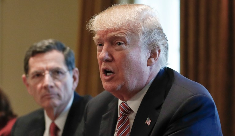 Sen. John Barrasso, R-Wyo., sits next to President Trump during a meeting with members of Congress about infrastructure in the Cabinet Room of the White House on Feb. 14, 2018.