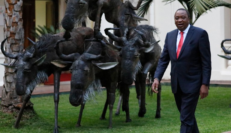Kenya's President Uhuru Kenyatta walks in Nairobi, Kenya.