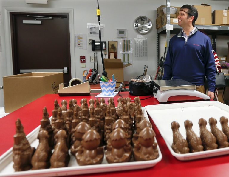 Donald Trump Jr., walks by a pan of chocolate candies as he tours Sarris Candies during a campaign stop for Republican Rick Saccone, Monday, March 12, 2018 in Canonsburg, Pa.