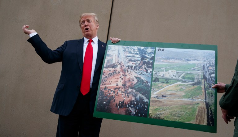 President Trump talks with reporters as he gets a briefing on border wall prototypes, Tuesday, March 13, 2018, in San Diego.