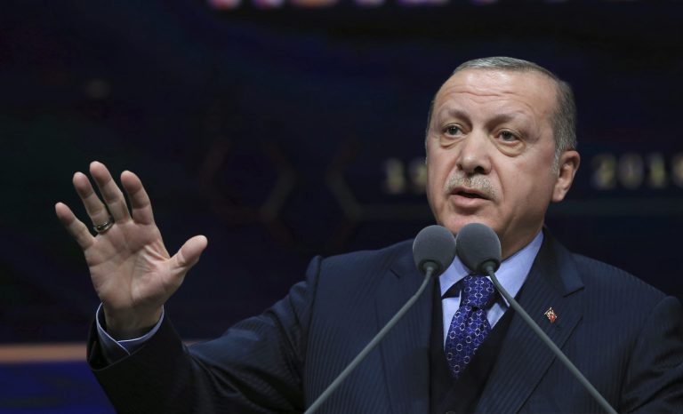 Turkey's President Recep Tayyip Erdogan speaks at a ceremony for judicial appointments in Ankara, Turkey, Monday, March 19, 2018. Erdogan says following victory in Syria's Afrin region, his country will expand its military operations into other Kurdish-held areas in Syria as well as in Iraq's Sinjar region.