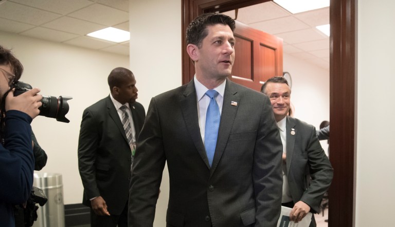 Speaker of the House Paul Ryan, R-Wis., walks to meet with reporters following a closed-door Republican strategy session on Capitol Hill in Washington.