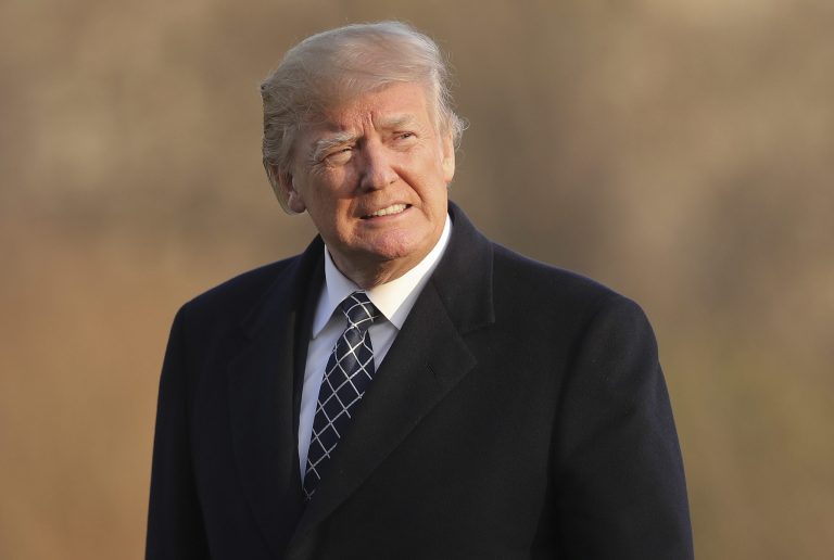 U.S. President Donald Trump walks across the South Lawn of the White House in Washington, Sunday, March 25, 2018, after returning from his Mar-a-Lago estate in Palm Beach, Fla.