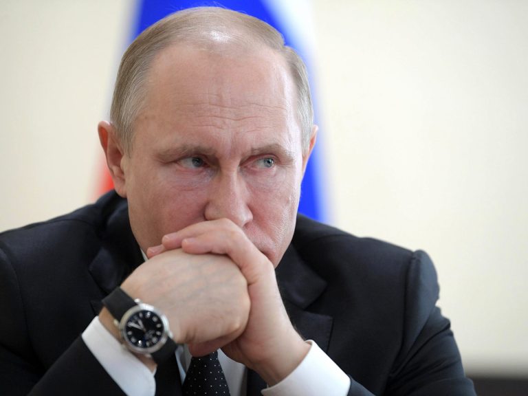 Russian President Vladimir Putin sits during a meeting in Moscow.