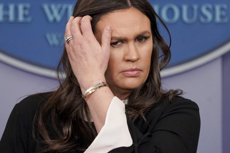 White House press secretary Sarah Huckabee Sanders listens to a question from a reporter during the daily press briefing at the White House, Tuesday, March 27, 2018, in Washington. Sanders discussed the removal of Russian diplomats, the opiate crisis, and other topics.
