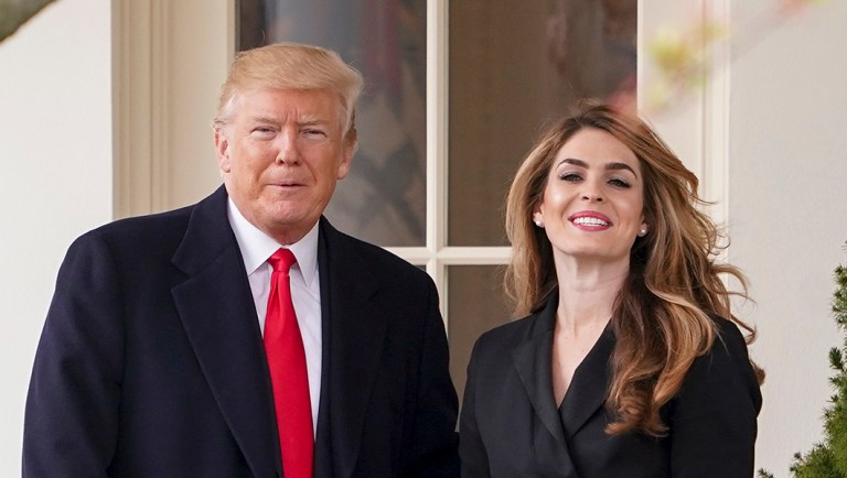 President Donald Trump poses for members of the media with White House Communications Director Hope Hicks on her last day before he boards Marine One on the South Lawn of the White House in Washington, Thursday, March 29, 2018.