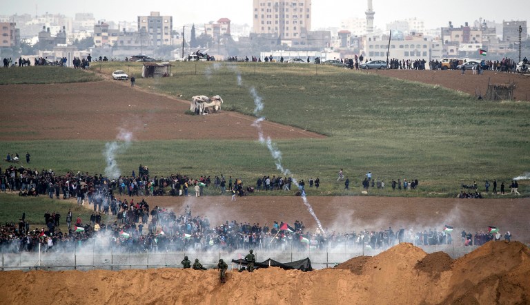 Palestinians clashed with Israeli troops along the Gaza border Friday morning as thousands gathered there for mass sit-ins led by the militant Islamic group Hamas that rules the territory.