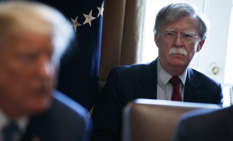 Newly ousted national security adviser John Bolton listens as President Donald Trump speaks during a cabinet meeting at the White House, Monday, April 9, 2018.