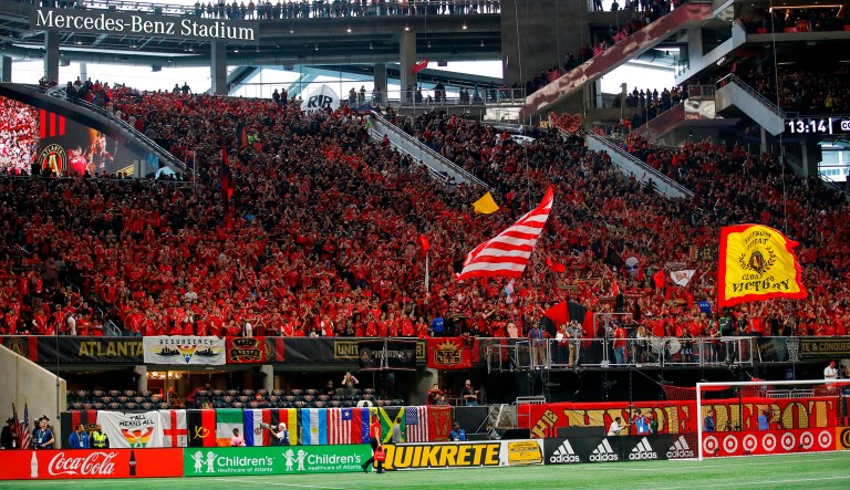 FILE - In this March 11, 2018, file photo, fans wait for an MLS soccer match between D.C. United and Atlanta United in Atlanta.  A FIFA evaluation committee wrapped up its visit to Atlanta on Wednesday, checking out possible venues for the 2026 World Cup. The committee toured Mercedes-Benz Stadium, one of the proposed venues for the joint bid from the United States, Canada and Mexico. The visit also included stops at the Georgia World Congress Center, which could presumably serve as the media headquarters, as well as Atlanta United's suburban training facility.
