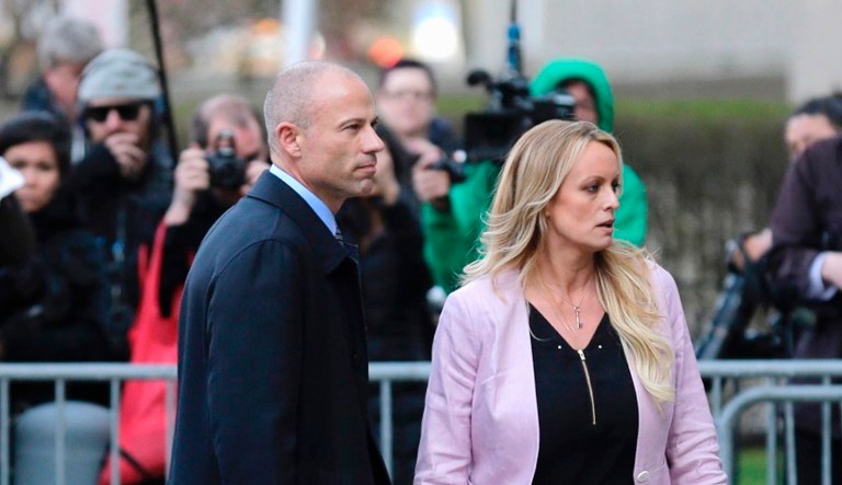 Porn actress Stormy Daniels, accompanied by her attorney, Michael Avenatti, left, leaves federal court on April 16 in New York.
