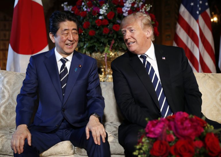 President Donald Trump and Japanese Prime Minister Shinzo Abe smile during their meeting at Trump's private Mar-a-Lago club, Tuesday, April 17, 2018, in Palm Beach, Fla.