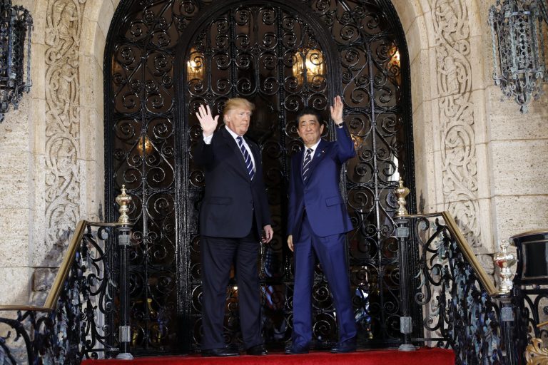 President Trump and Japanese Prime Minister Shinzo Abe wave at Trump's private Mar-a-Lago club on Tuesday in Palm Beach, Fla.