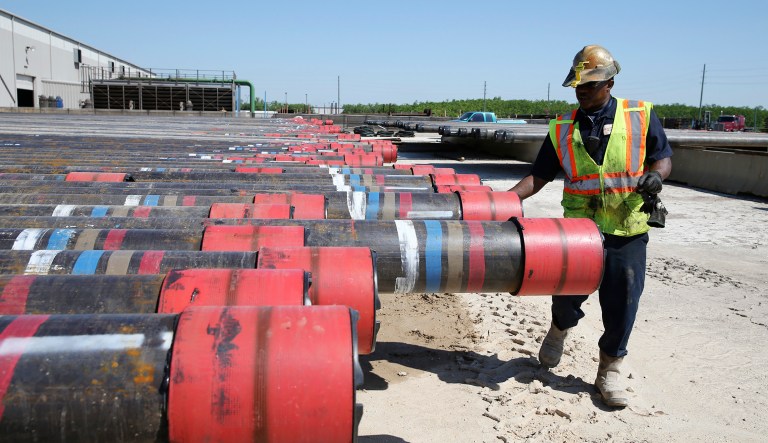 Taurice Jones inspects steel pipes as part of quality control at the Borusan Mannesmann plant in Baytown, Texas.