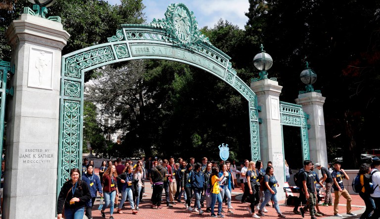 FILE - In this Aug. 15, 2017 file photo, students walk on the University of California, Berkeley campus in Berkeley, Calif. The University of California's governing board will not be asked to vote on raising tuition at next month's meeting, so officials and students can continue lobbying for more state funding, UC President Janet Napolitano said Thursday, April 26, 2018.