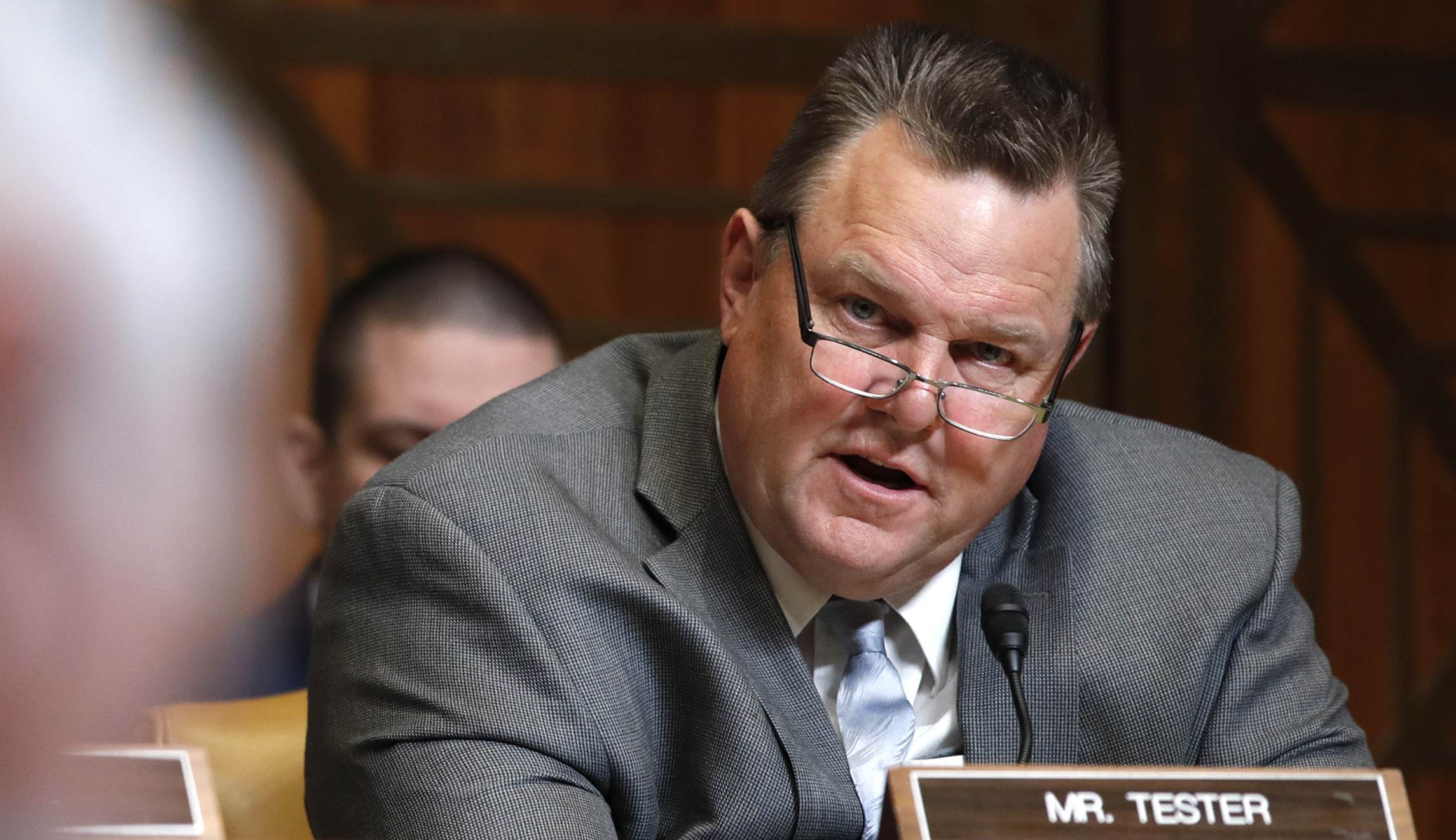 Sen. Jon Tester, D-Mont., right, speaks during a hearing.