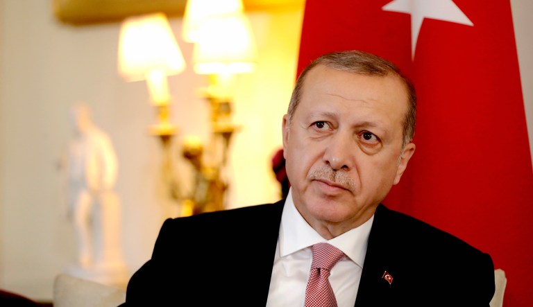 Turkish President Recep Tayyip Erdogan looks up as he finishes making remarks in front of the media at the start of a meeting in London on Tuesday.