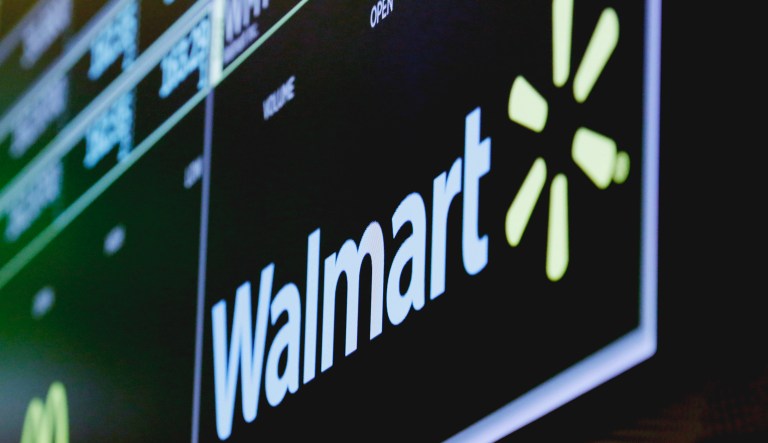 The logo for Walmart appears above a trading post on the floor of the New York Stock Exchange, Thursday, May 17, 2018. Walmart is reporting better-than-expected profit and revenue for the first quarter with rebounding online sales.