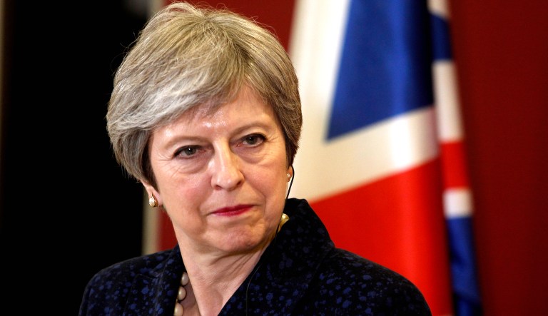 British Prime Minister Theresa May looks on during a news conference.