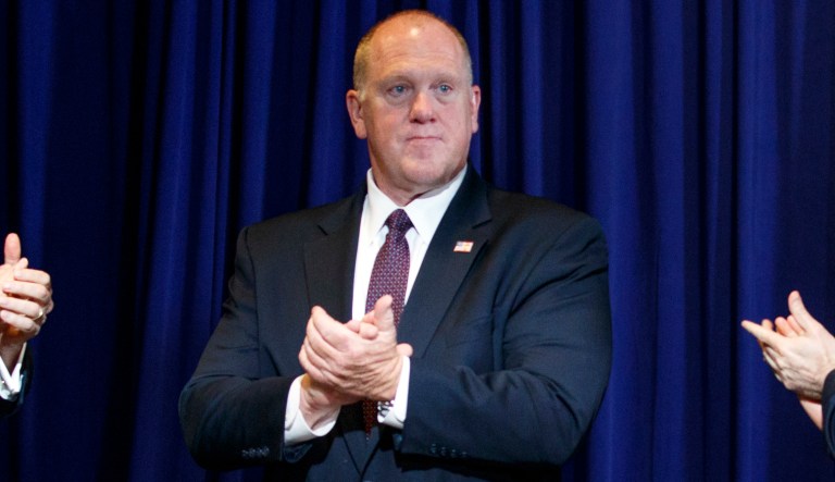Deputy Attorney General Rod Rosenstein, from left, acting director of Immigration and Customs Enforcement Thomas Homan, acting Assistant Attorney General John Cronan, applaud as President Donald Trump arrives to speak at a roundtable on immigration policy at Morrelly Homeland Security Center, Wednesday, May 23, 2018, in Bethpage, N.Y.  
