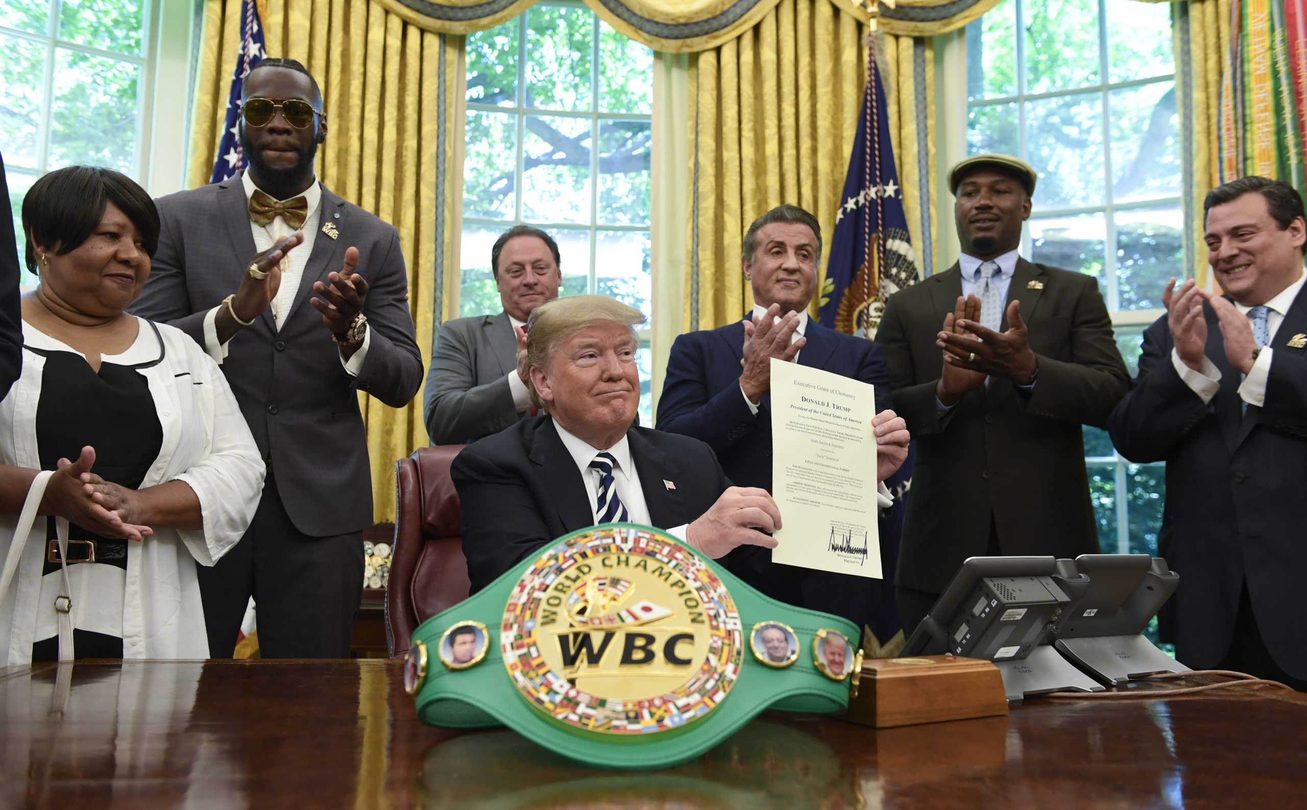 Linda Haywood, who is Johnson's great-great niece, heavyweight champion Deontay Wilder, Keith Frankel, Sylvester Stallone, former heavyweight champion Lennox Lewis, and World Boxing Council President Mauricio Sulaiman Saldivar. (AP Photo/Susan Walsh)