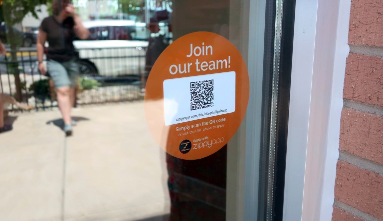In this May 25, 2018, photo, a decal with a QR code at the entrance to a Chick-fil-A in Phillipsburg, N.J.,invites people to apply for work at the restaurant. On Tuesday, June 5, the Labor Department reports on job openings and labor turnover for April. 