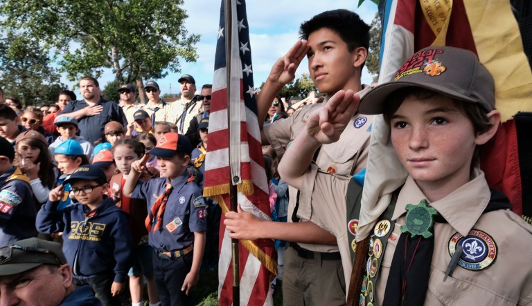 Boy Scouts salute during a ceremony at the Los Angeles National Cemetery on Saturday, May 26, 2018.
