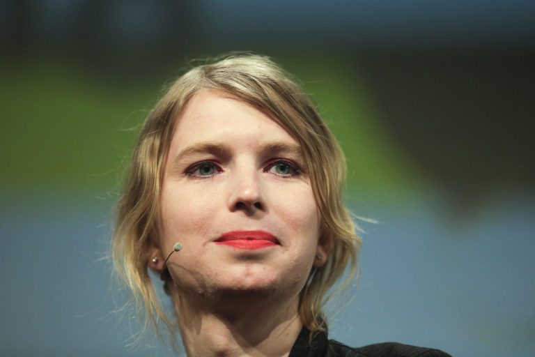 Chelsea Manning attends a discussion at a media convention.