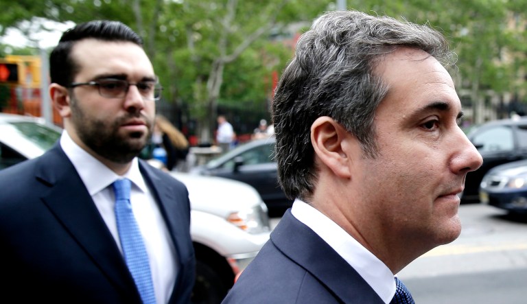 Michael Cohen (pictured right) arrives to court in New York on Wednesday.