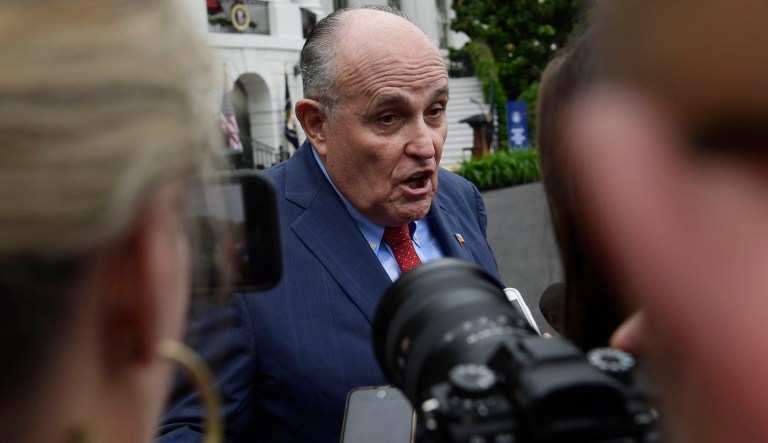 President Donald Trump's lawyer Rudy Giuliani speaks to reporter's following the White House Sports and Fitness Day event on the South Lawn of the White House in Washington, Wednesday, May 30, 2018.