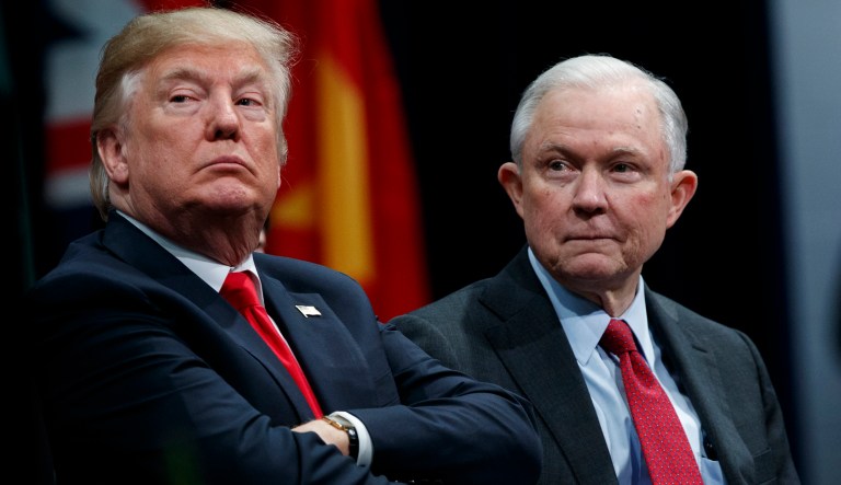 President Trump sits with Attorney General Jeff Sessions during the FBI National Academy graduation ceremony in Quantico, Va. 