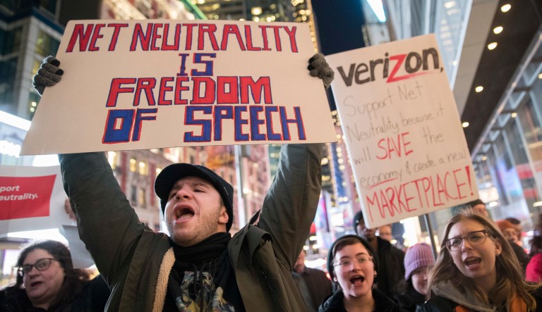 Demonstrators rally in support of net neutrality outside a Verizon store in New York. 