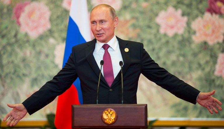 Russian President Vladimir Putin gestures while speaking during his news conference after the Shanghai Cooperation Organization (SCO) Summit in Qingdao in eastern China's Shandong Province, Sunday, June 10, 2018. Putin says counter-terrorism efforts are a priority for a regional grouping led by Moscow and Beijing. Putin said a new agreement approved by the SCO spells out plans for joint-anti-terror efforts for the next three years. The SCO includes China, Russia, four ex-Soviet Central Asian nations, India and Pakistan.