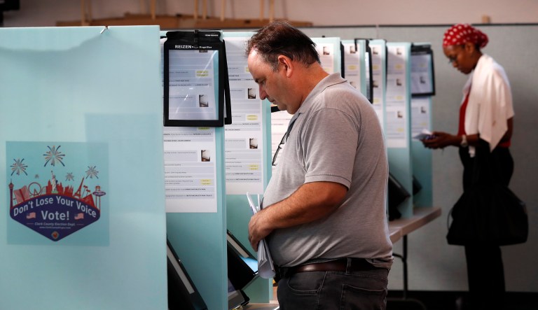 Wayne Freeman votes in the primary election at the Green Valley Presbyterian Church in Henderson, Nev., Tuesday, June 12, 2018. Officials reported âisolatedâ primary voting glitches Tuesday involving the state's new touch-screen voting machines in Nevadaâs two most populous areas, Las Vegas and Reno, and blamed a technical problem for delaying the count of ballots in one rural northern county. 