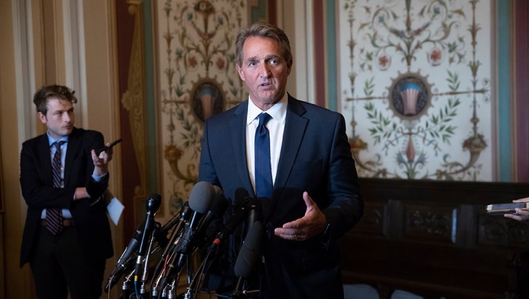 Sen. Jeff Flake, R-Ariz., a member of the Senate Foreign Relations Committee speaks with reporters about meeting with Canada's Minister of Foreign Affairs Chrystia Freeland on Capitol Hill in Washington, Wednesday, June 13, 2018. The meeting with Freeland comes after President Donald Trump insulted Canadian Prime Minister Justin Trudeau at the Group of Seven summit, calling him "dishonest" and "weak," after the prime minister spoke against American tariffs on steel and aluminum. 