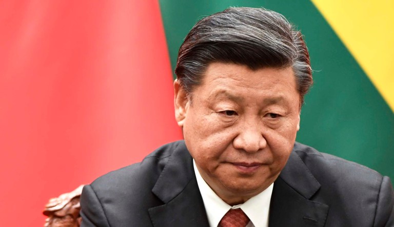 Chinese President Xi Jinping sits during a meeting.