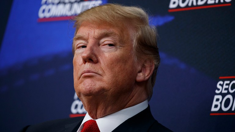 President Trump listens during an event on immigration alongside family members affected by crime committed by undocumented immigrants, at the South Court Auditorium on the White House complex on Friday.