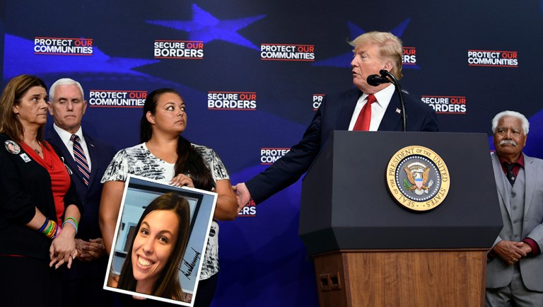 President Donald Trump, second from right, speaks as others listen during an event on the White House complex in Washington, Friday, June 22, 2018, with people who have lost family members from crime committed by undocumented immigrants. (AP Photo/Susan Walsh)