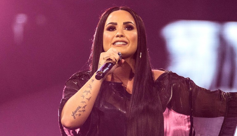 Demi Lovato performs on stage.