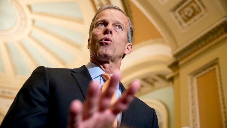 Sen. John Thune, R-S.D., speaks with reporters following a closed-door luncheon on Capitol Hill.