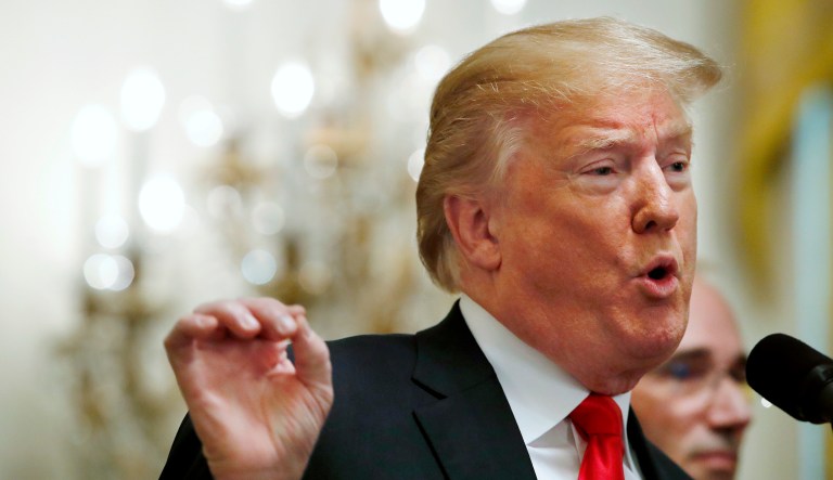 President Trump gestures while speaking about taxes on June 29, 2018, during an event in the East Room of the White House in Washington.
