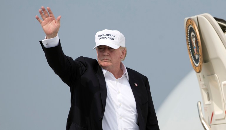 President Trump waves as he boards Air Force One.