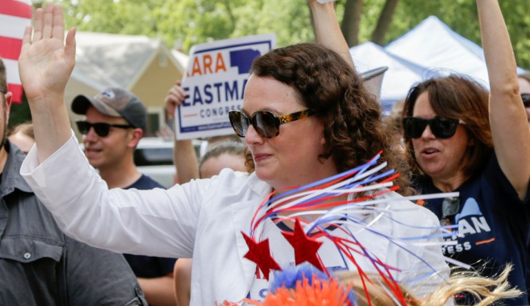 Democratic House candidate Kara Eastman waves as she participates in a 4th of July parade in Ralston, Neb., Wednesday, July 4, 2018. Eastman is challenging Nebraska's 2nd district Rep. Don Bacon, R-Neb., in the upcoming November elections.