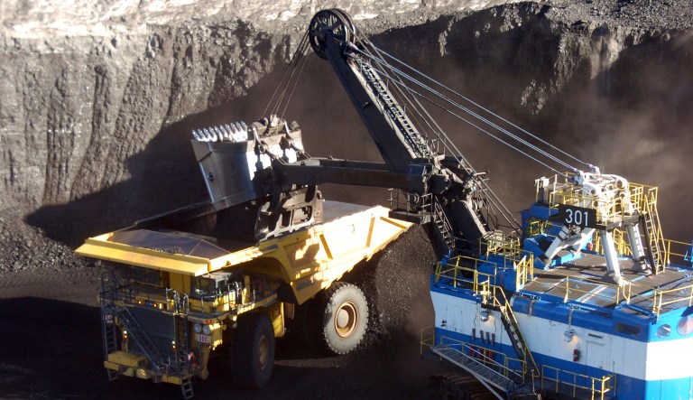 A mechanized shovel loads coal from an 80-feet thick seam into a haul truck at Cloud Peak Energy's Spring Creek mine near Decker, Mont.