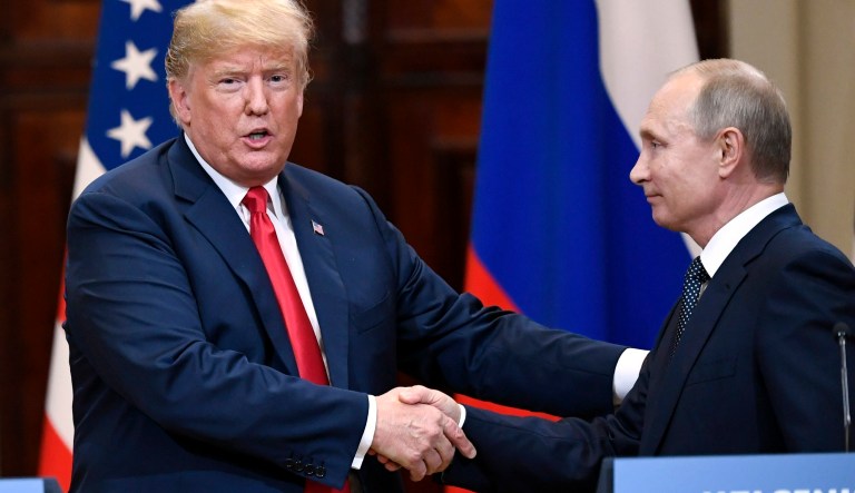 U.S. President Donald Trump and Russian President Vladimir Putin shake hands after a joint press conference at the Presidential Palace in Helsinki, Finland, Monday, July 16, 2018.
