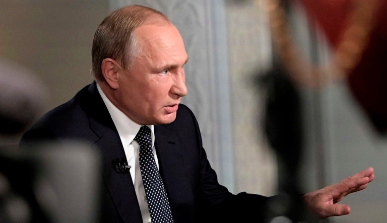 Russian President Vladimir Putin gestures during an interview with "Fox News Sunday" host Chris Wallace.