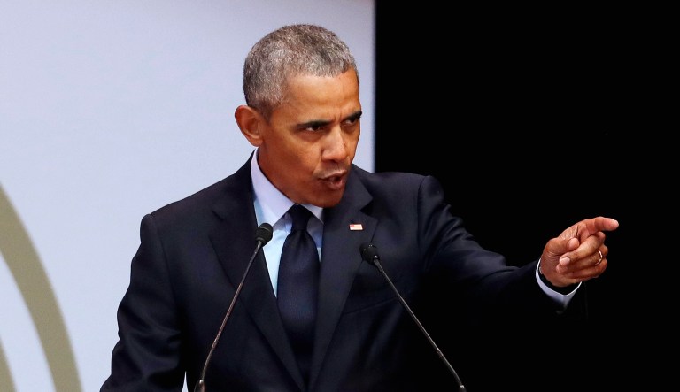 Former U.S. President Barack Obama, left, delivers his speech at the 16th Annual Nelson Mandela Lecture at the Wanderers Stadium in Johannesburg, South Africa, on Tuesday.